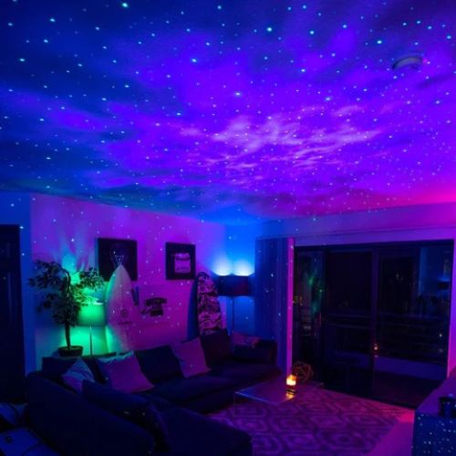 SpaceNaut galaxy projector lighting up a bedroom ceiling with stars
