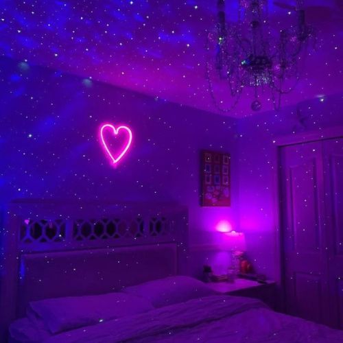 SpaceNaut galaxy projector lighting up a bedroom ceiling with stars
