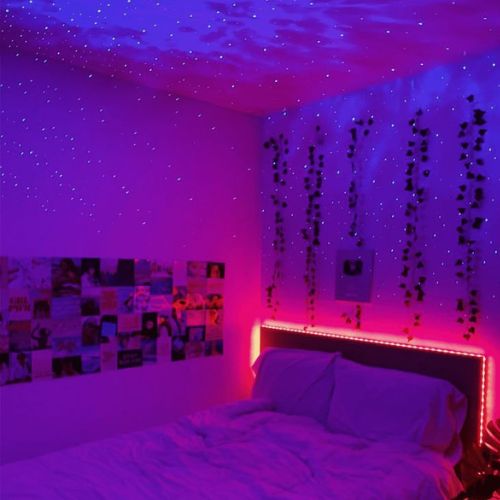 SpaceNaut galaxy projector lighting up a bedroom ceiling with stars